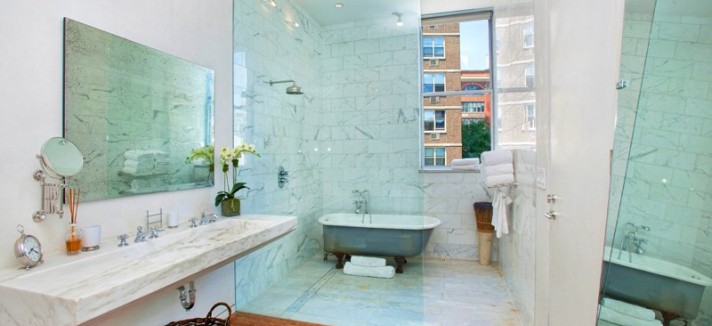 the-bathroom-is-more-modern-with-glass-and-mirrors-defining-the-perimeters