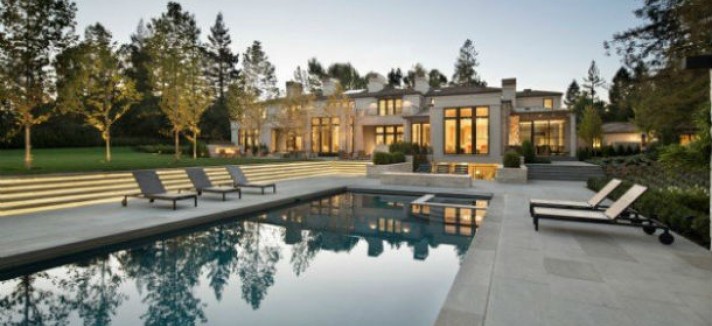 a-pool-fire-pit-and-patio-area-sit-just-outside-the-main-house