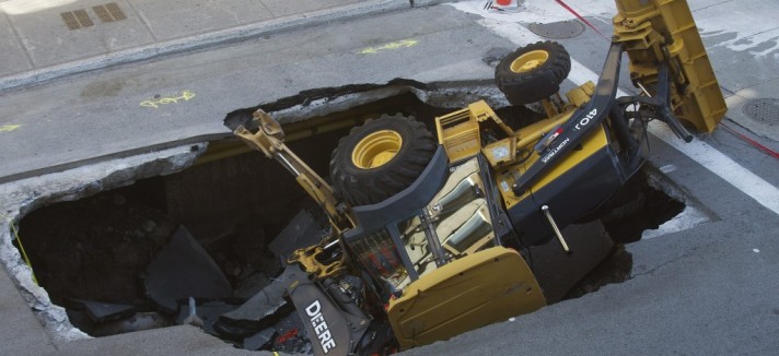 canada_sinkhole_swallows_backhoe-graham_hughes-ap