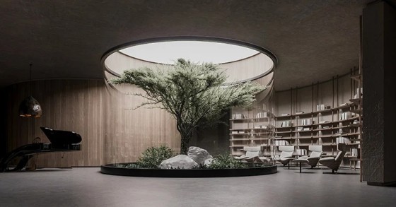 Uma casa bunker com um design moderno e minimalista no meio do campo