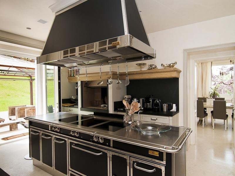 the-gourmet-kitchen-has-a-lot-of-character-compared-to-the-rest-of-the-all-white-rooms-the-black