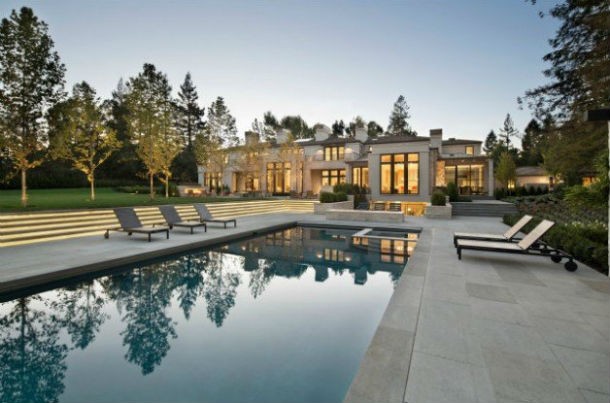 a-pool-fire-pit-and-patio-area-sit-just-outside-the-main-house