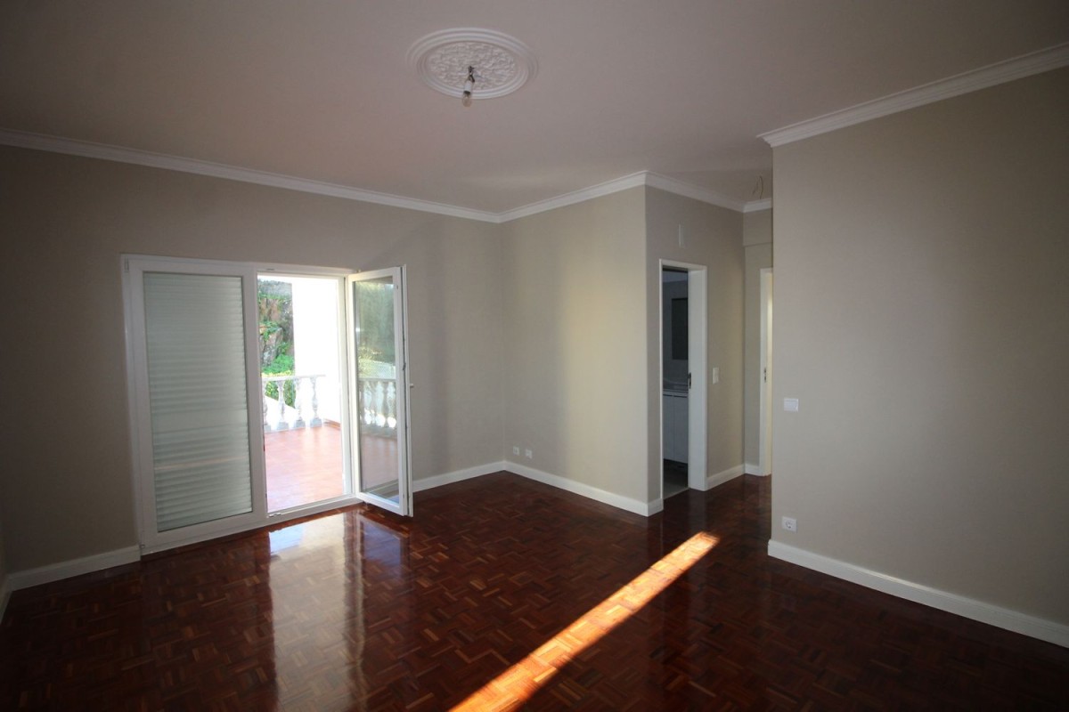 Each of the 22 bedrooms has dark, polished wood flooring