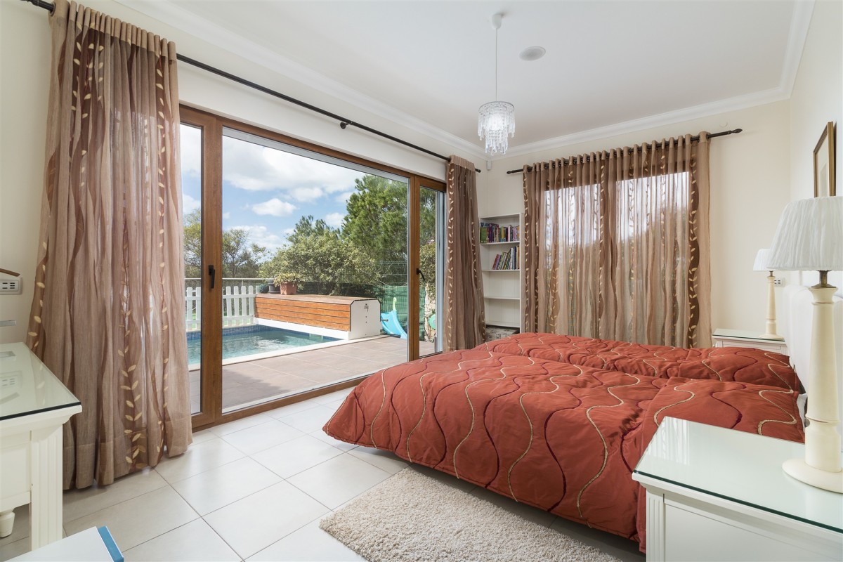 One of the bedrooms leads right out onto the swimming pool