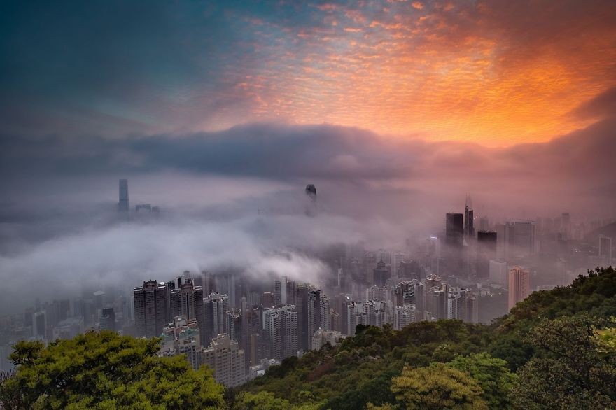 'Sunrise Glow Decorates The City In Fog'
