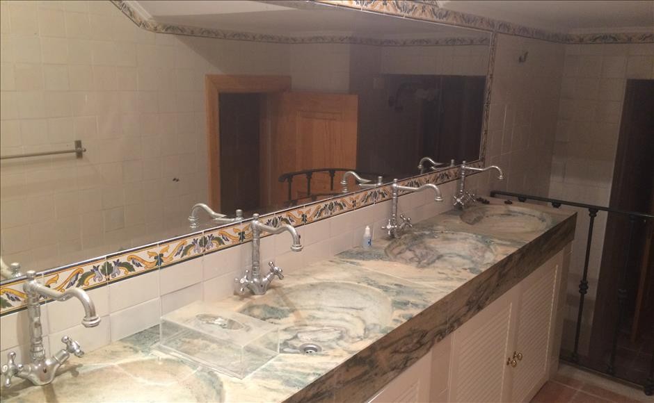 A bathroom with marble sinks