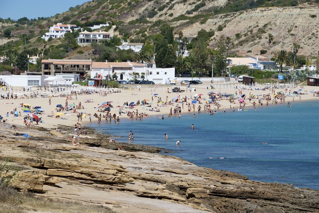 Sunbathing and swimming at Praia da Luz are a great summer plan / Flickr