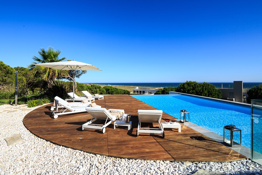 The pool and terrace have great views over the beach and sea