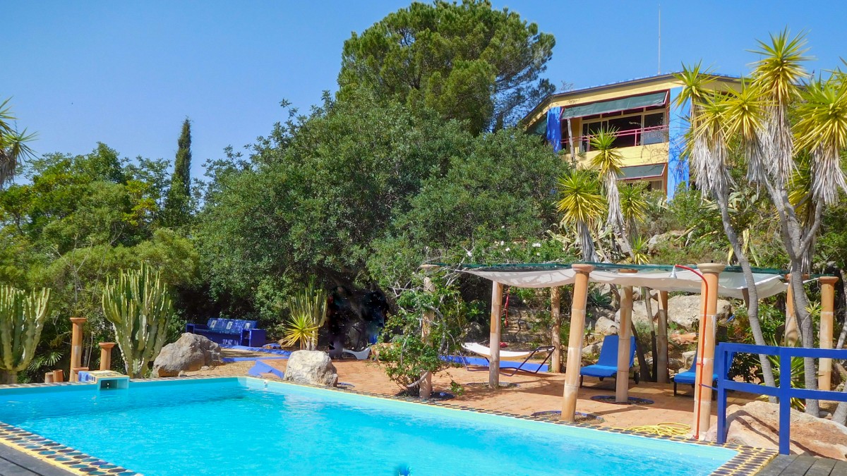 The main house from the outside with pool and lounge area