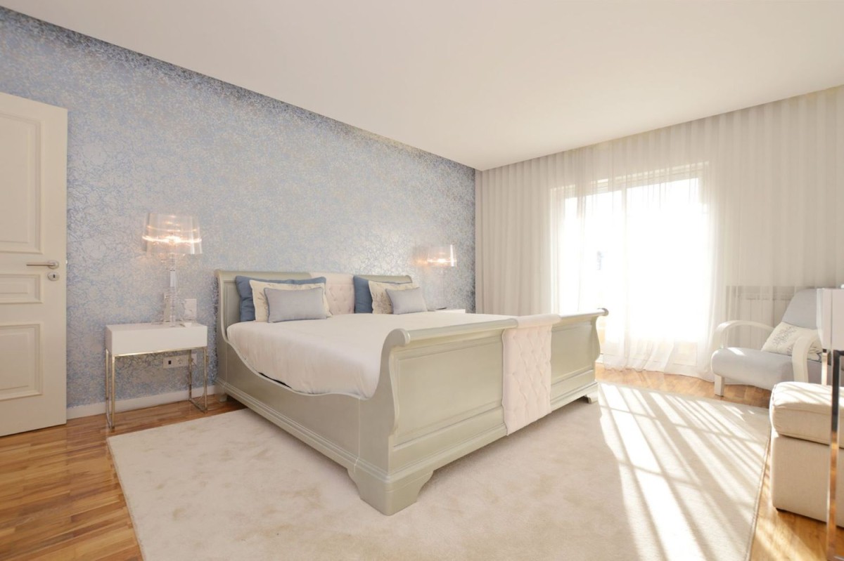 Bedroom with large window allowing natural light