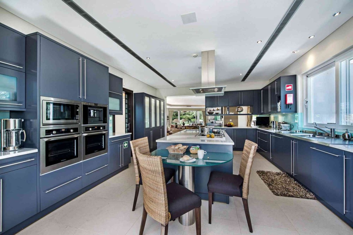 The villa has a modern kitchen with cooking island