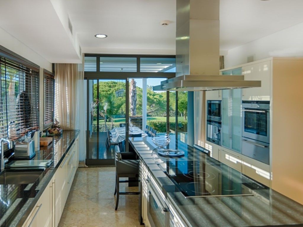 The villa has a modern, fully-equipped kitchen