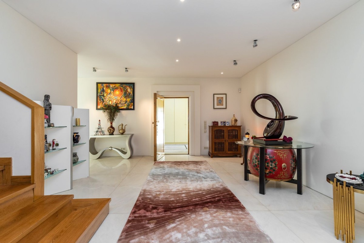 White granite tiles and wooden elements fill the property