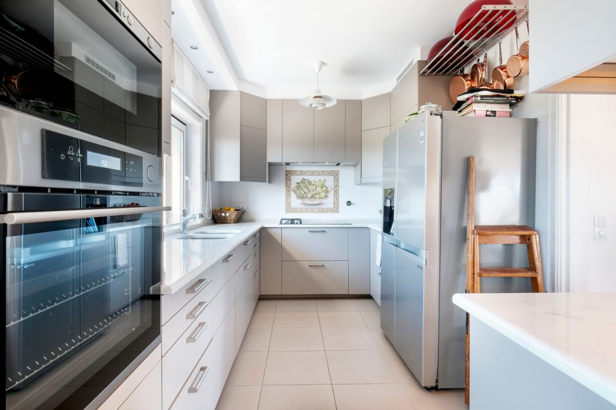 The kitchen is modern and has high-quality appliances