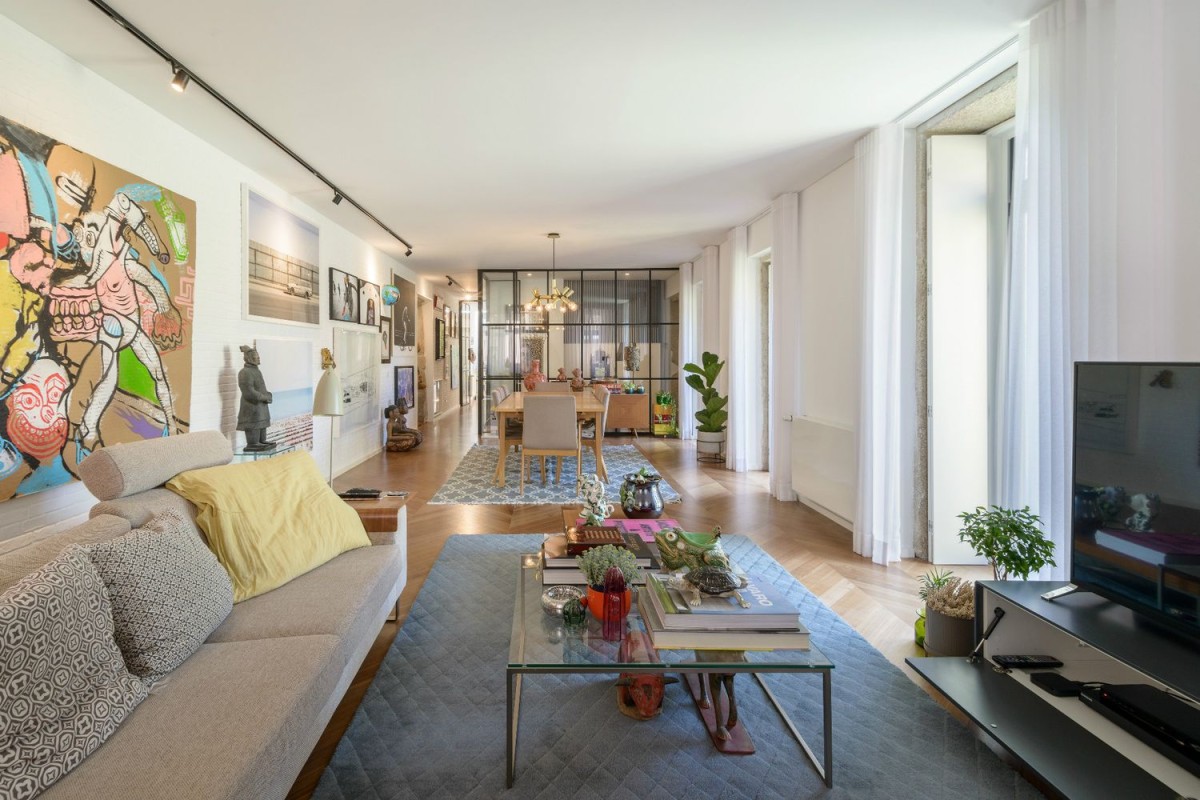 The living and dining area is bright with colourful decoration
