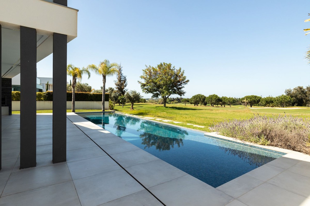 The property has a luxury pool and views over the golf course