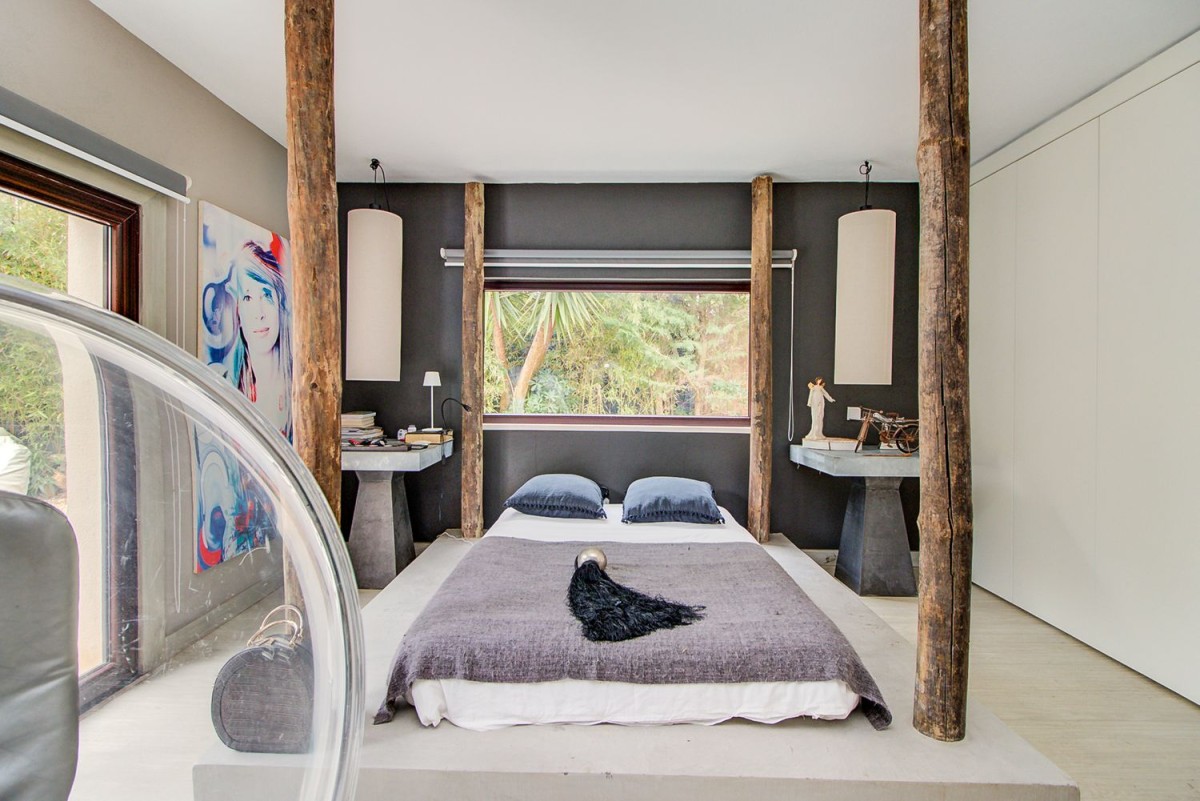 The bedrooms are spacious and also make use of wood as a unique design feature