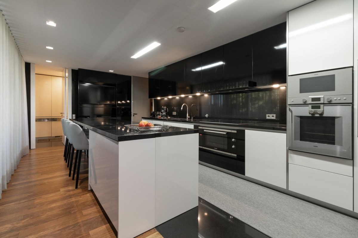 The kitchen is modern and spacious