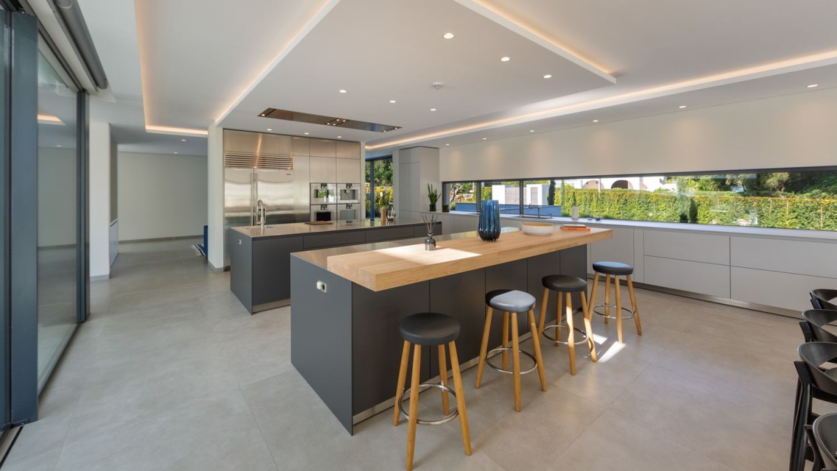 The kitchen is modern and spacious