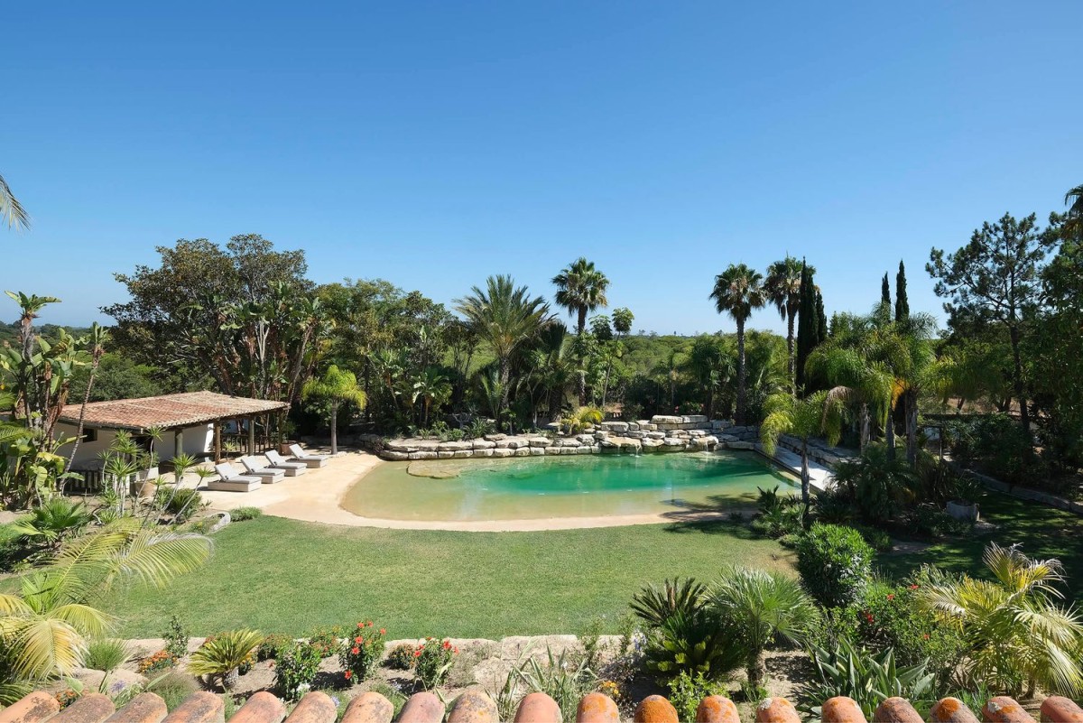 The property has a beautiful garden and a salt water pool