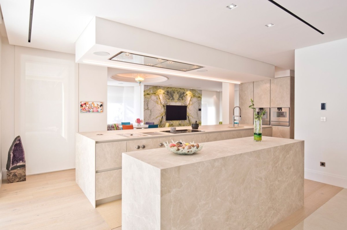 The kitchen is modern and spacious