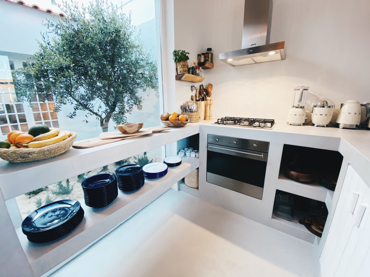 The compact kitchen is modern with top of the range appliances 