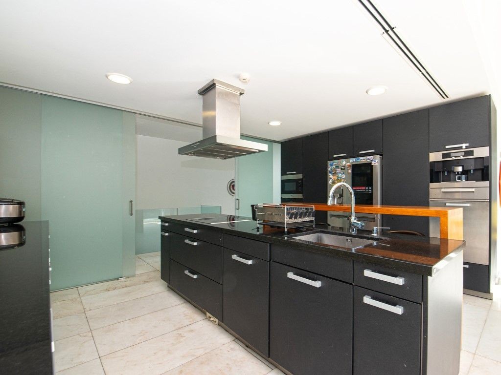 The kitchen is modern and spacious