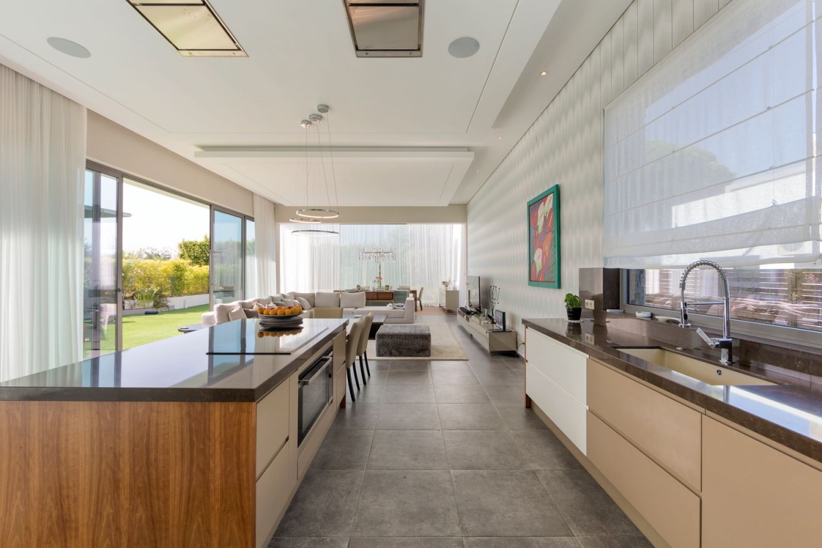 The kitchen is modern and spacious