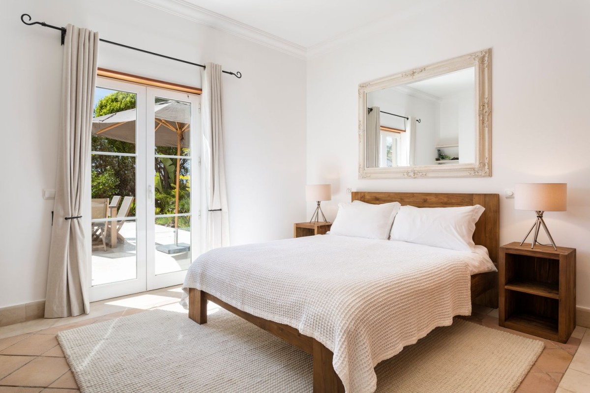 The bedrooms follow the same neutral colour palette