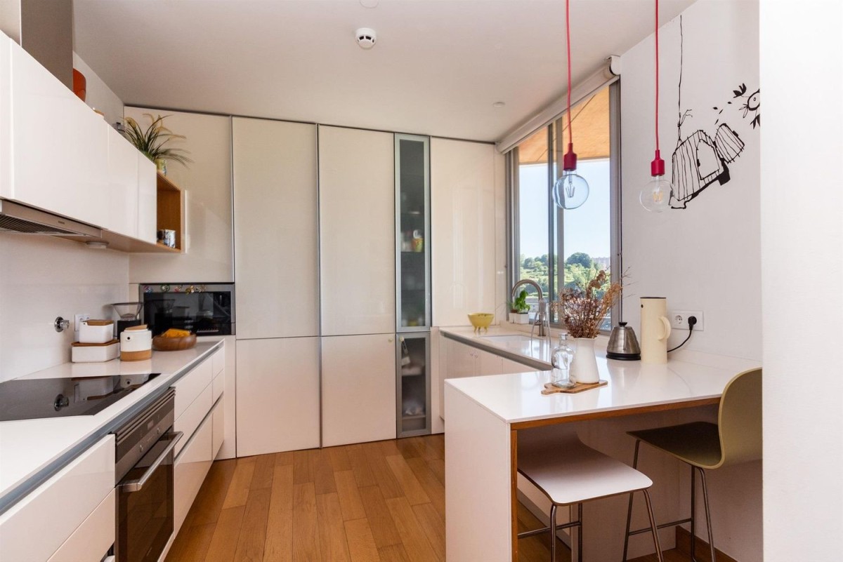 The kitchen in the property is small but modern with top of the range appliances