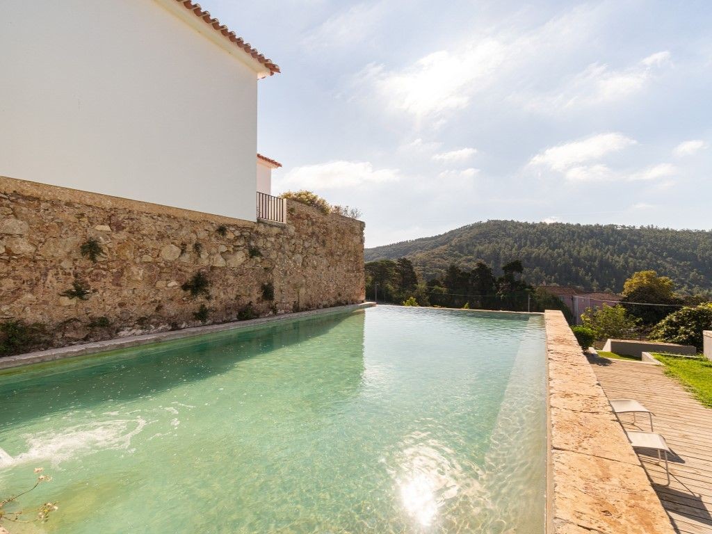 The property has a beautiful pool with countryside views