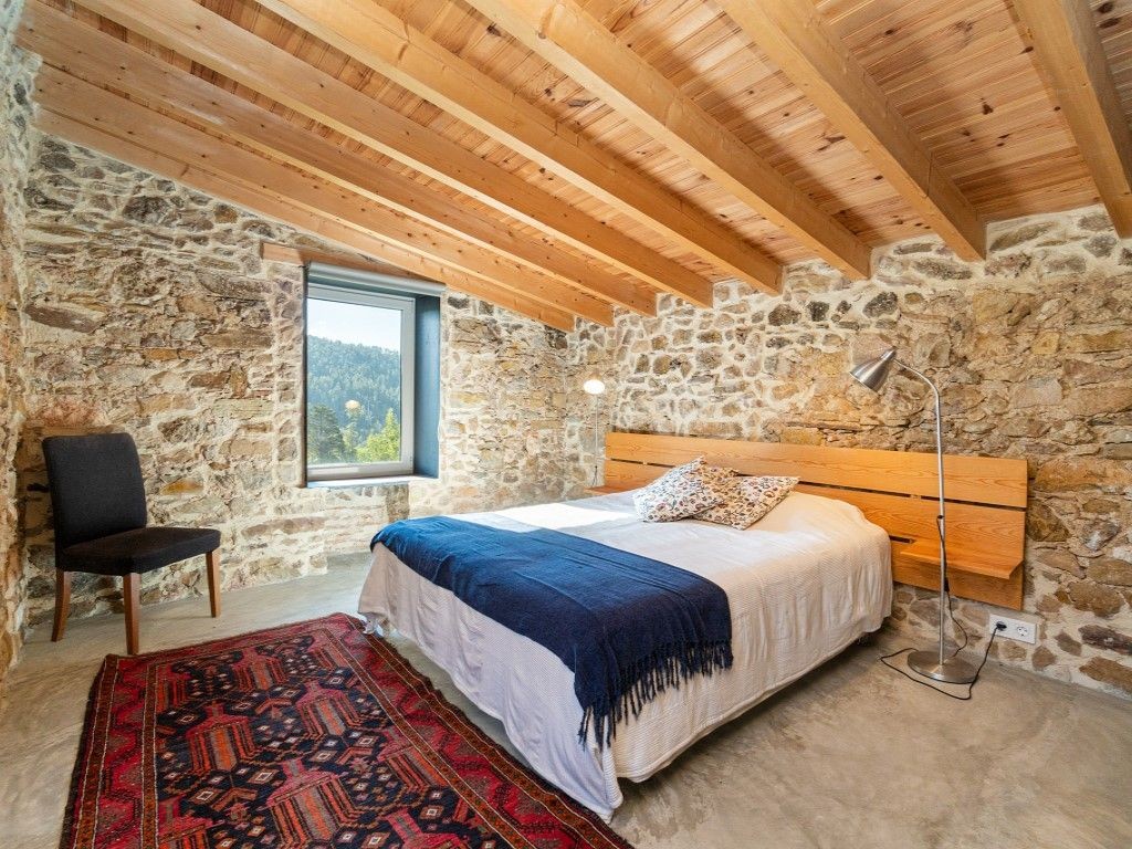 Many of the rooms have original features such as wooden beams and stonework