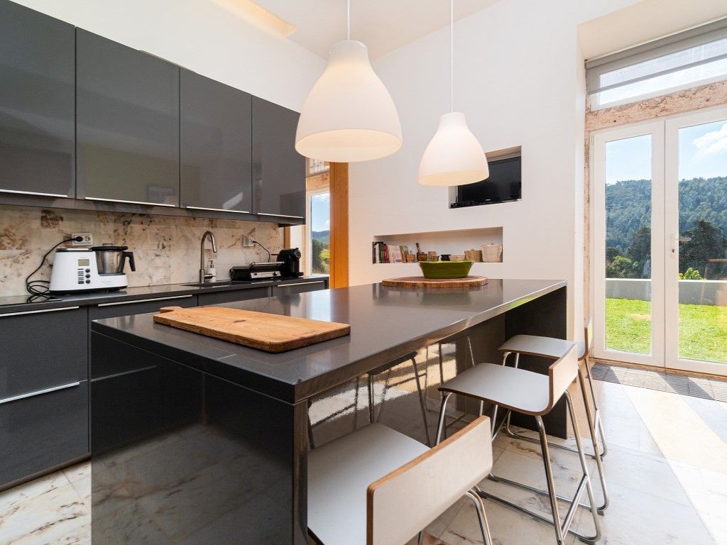 The kitchen adds a modern touch and leads to the garden