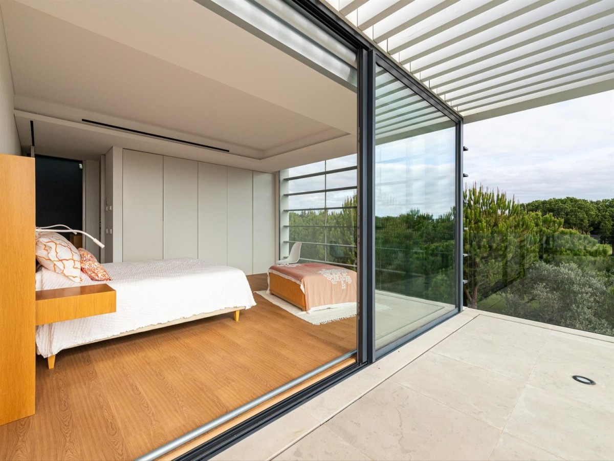 This beautiful bedroom is filled with natural light