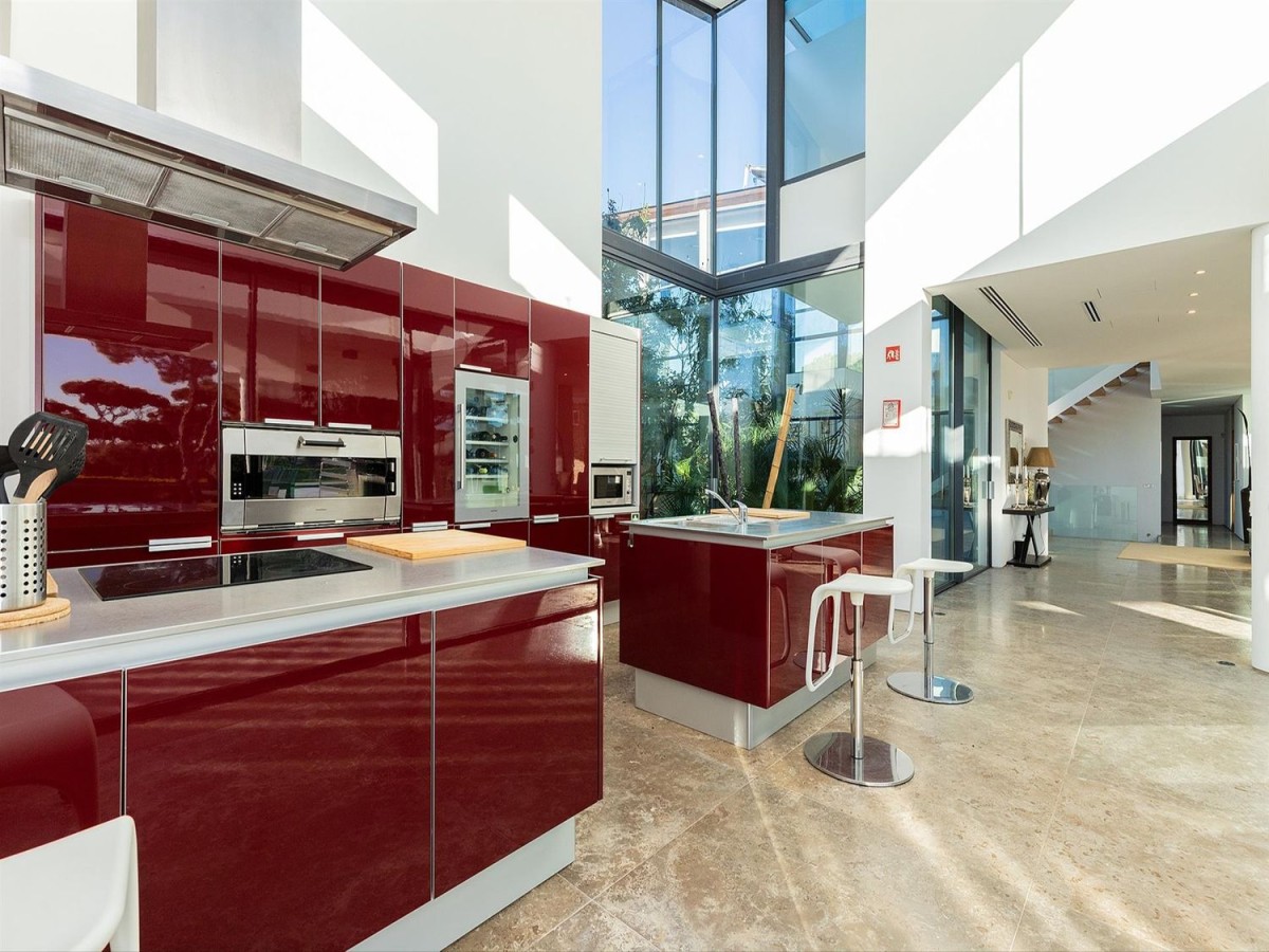 The kitchen has a modern design and is spacious