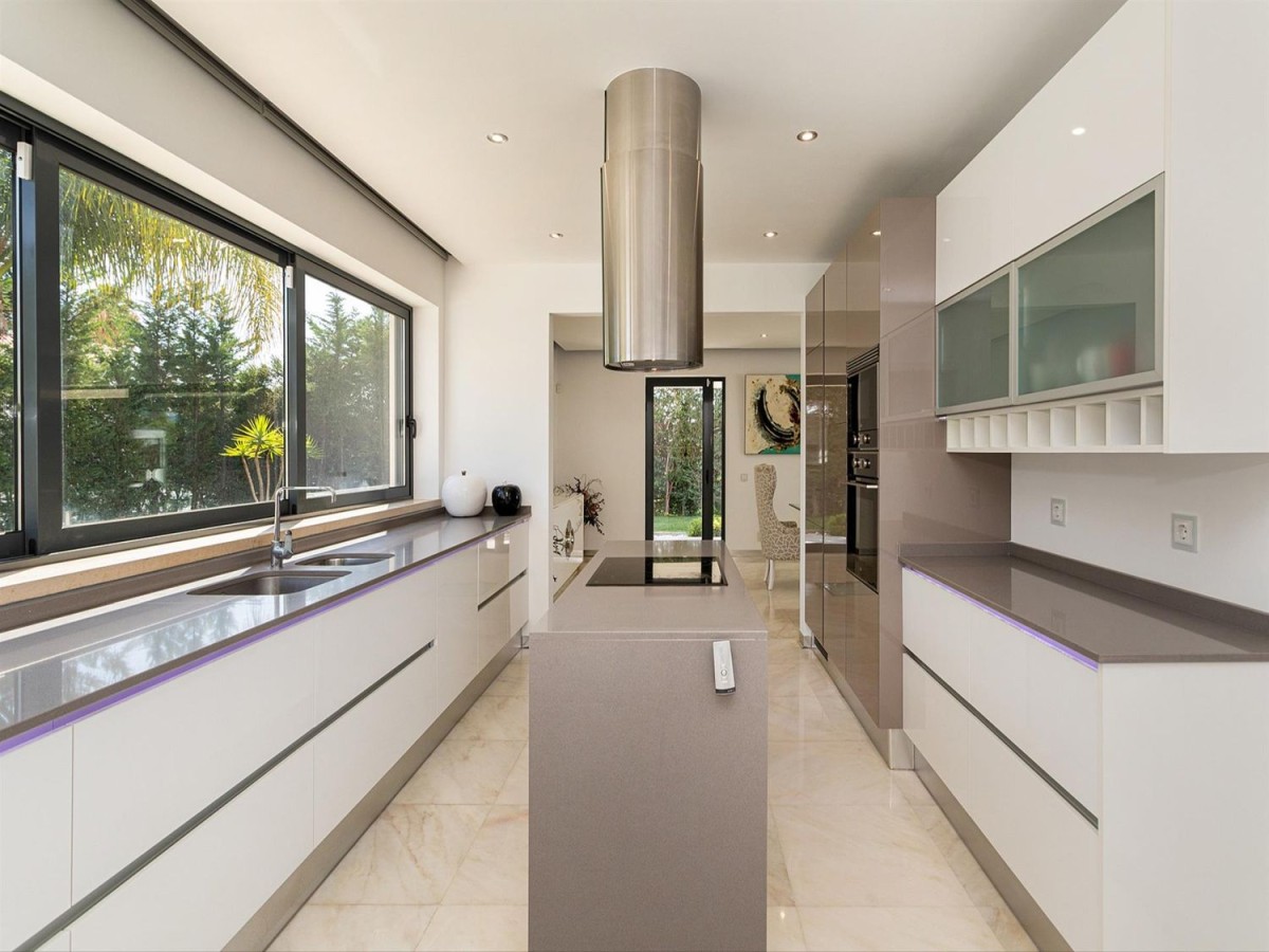 The kitchen is modern and with top of the range appliances