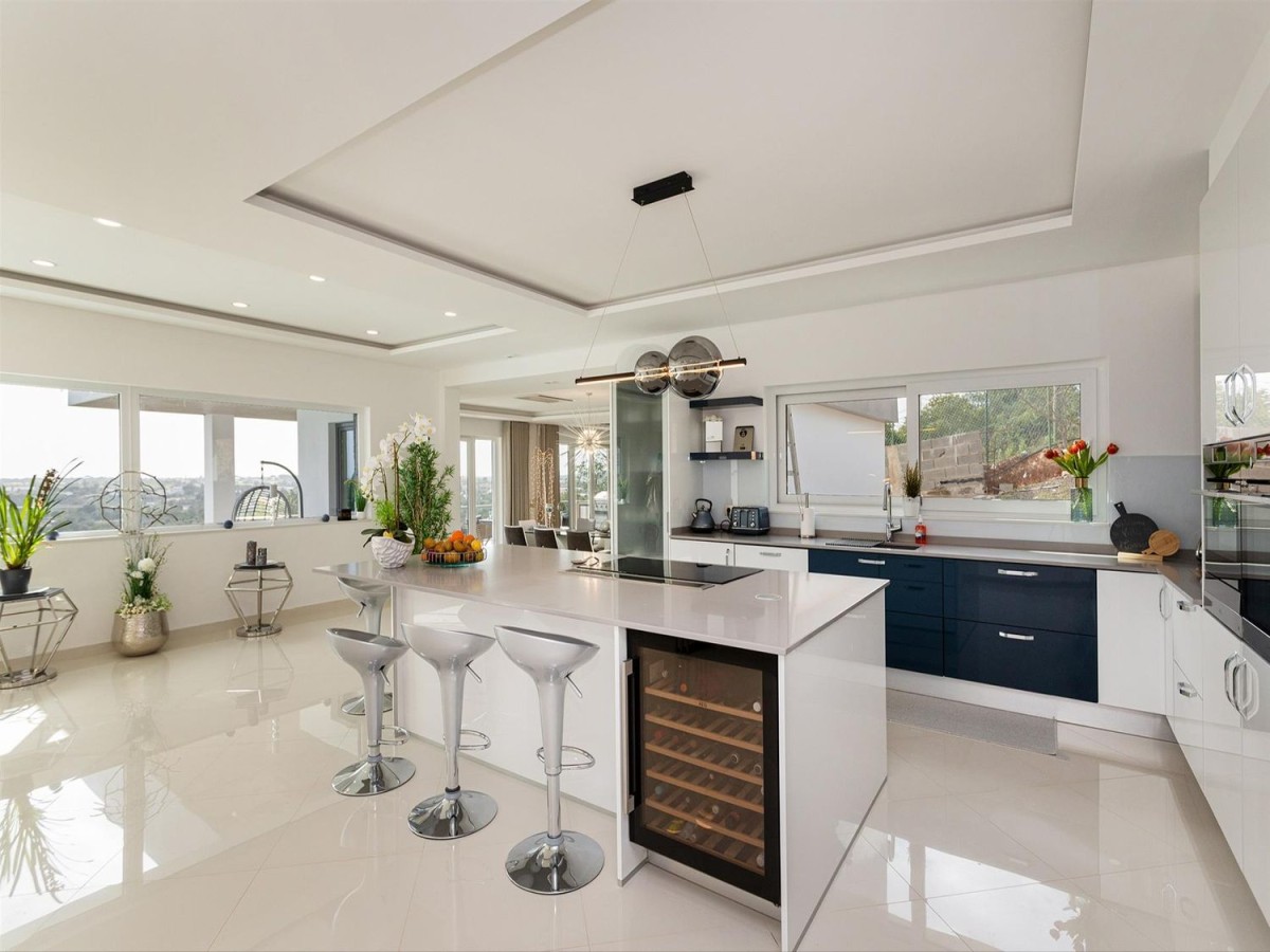 The kitchen is modern and with top of the range appliances