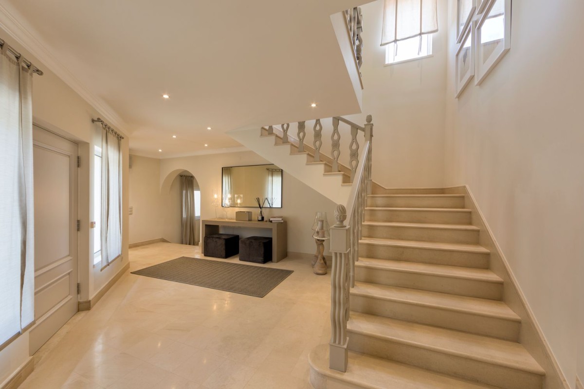 The property has an impressive staircase in the centre of the property