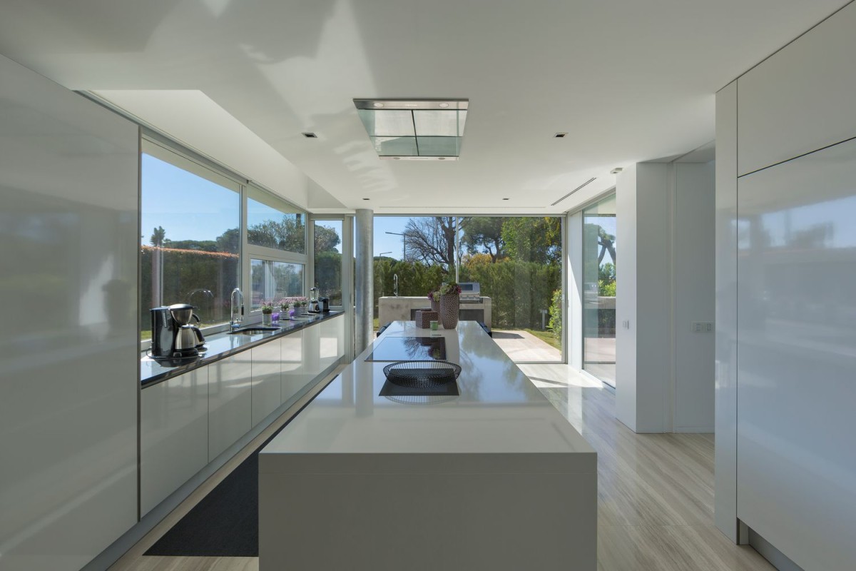 The modern kitchen leads onto a pleasant patio area