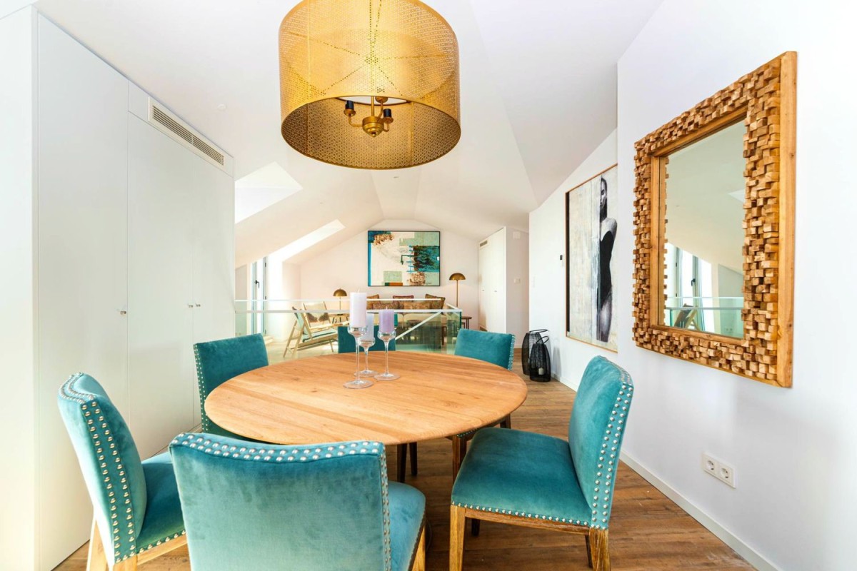 The main living and dining area on the top floor is open and spacious The main living and dining area on the top floor is open and spacious