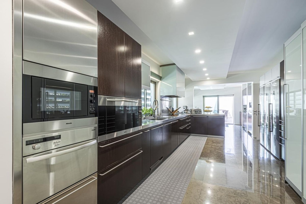 The spacious kitchen has a modern design