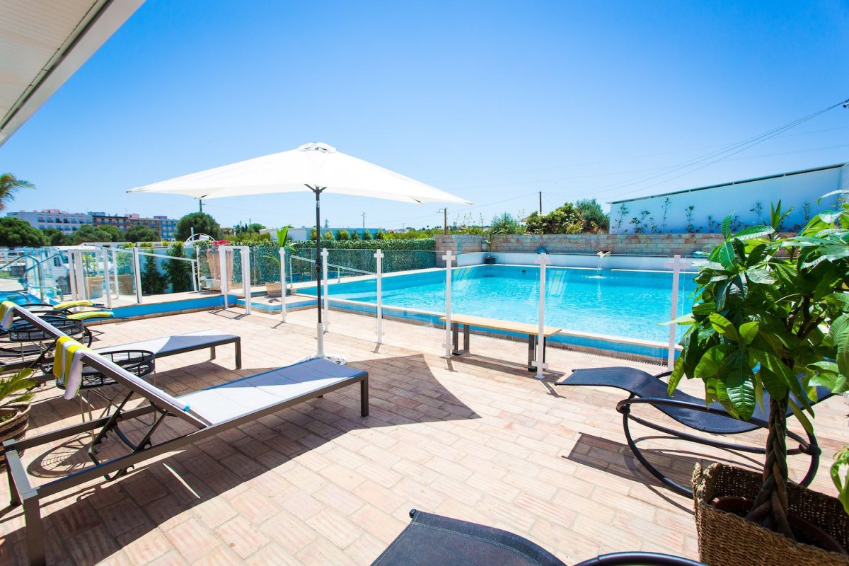 The property has a stunning outdoor pool surrounded by idyllic terraces