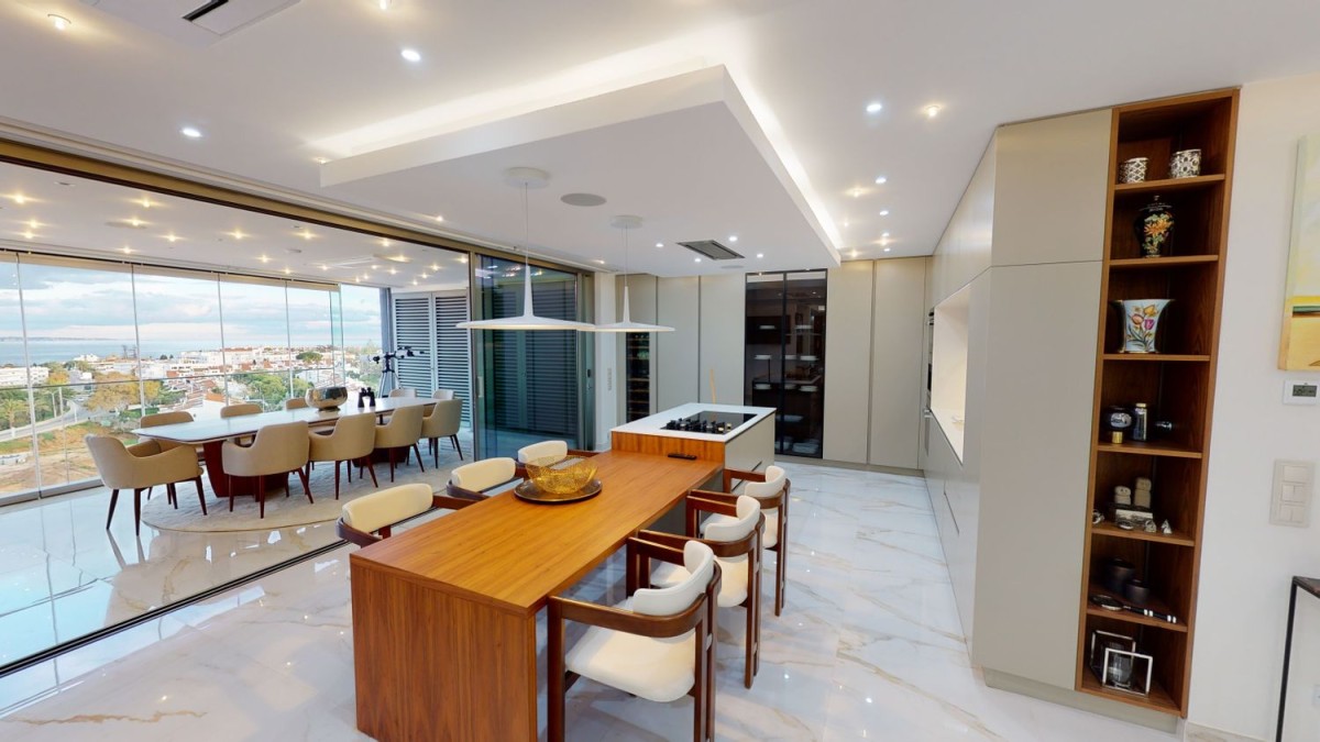 The kitchen-dining area has a sleek, modern design