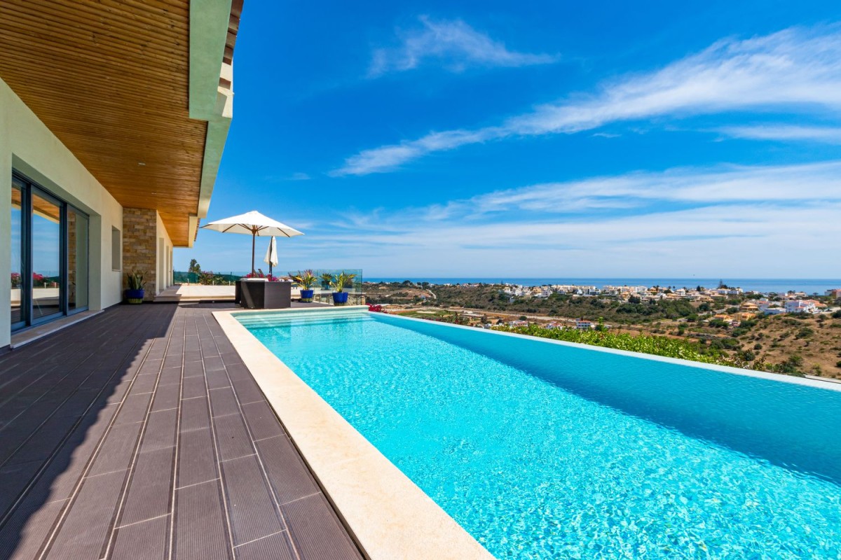 The villa has a lovely pool with sea views