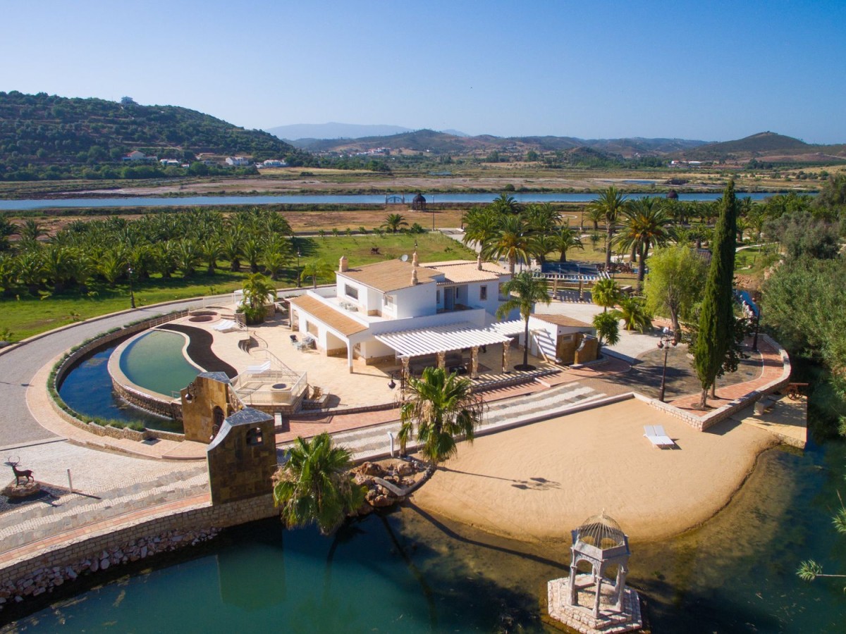 This stunning villa has its own lakeside beach