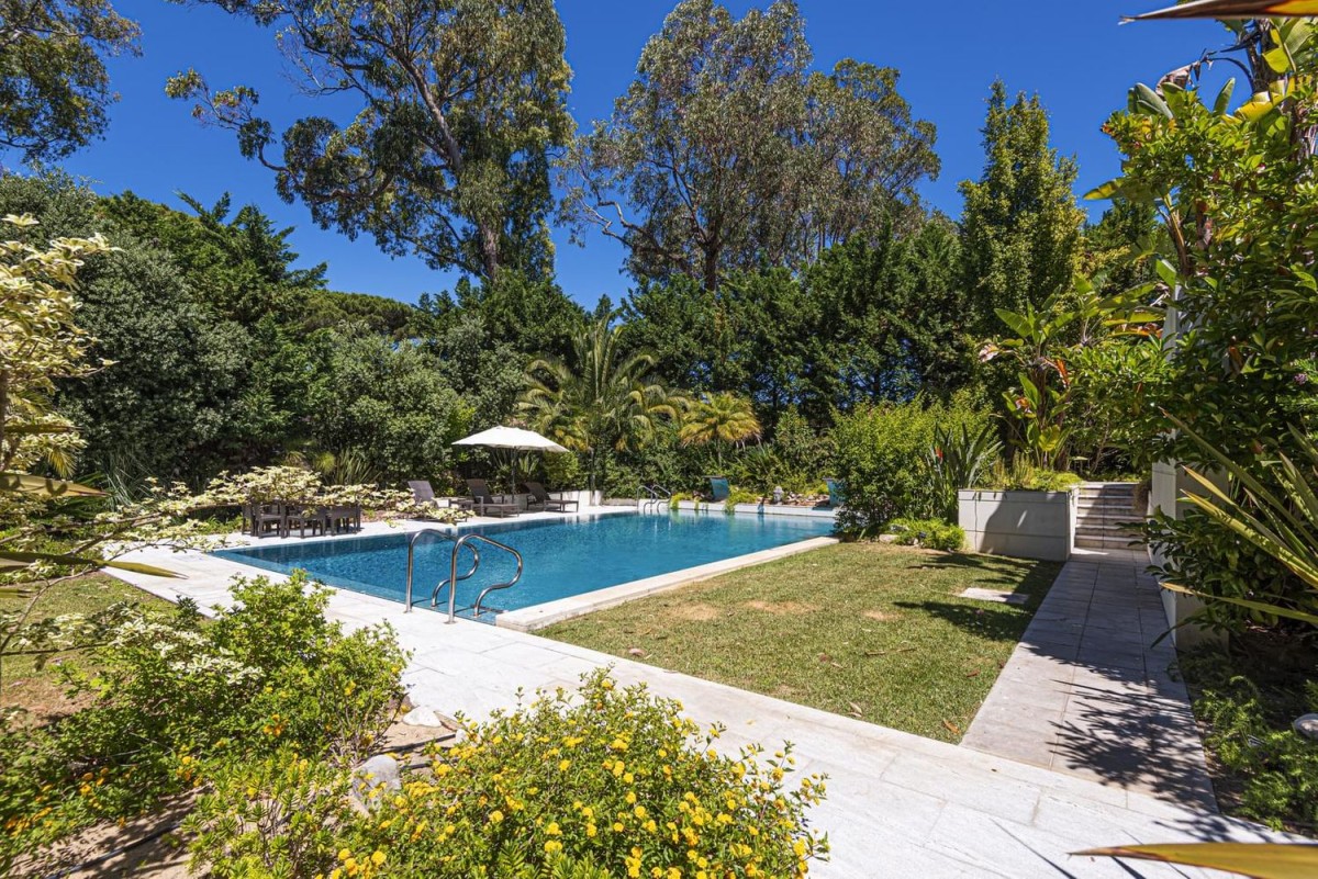 The outdoor pool, surrounded by the beautiful gardens