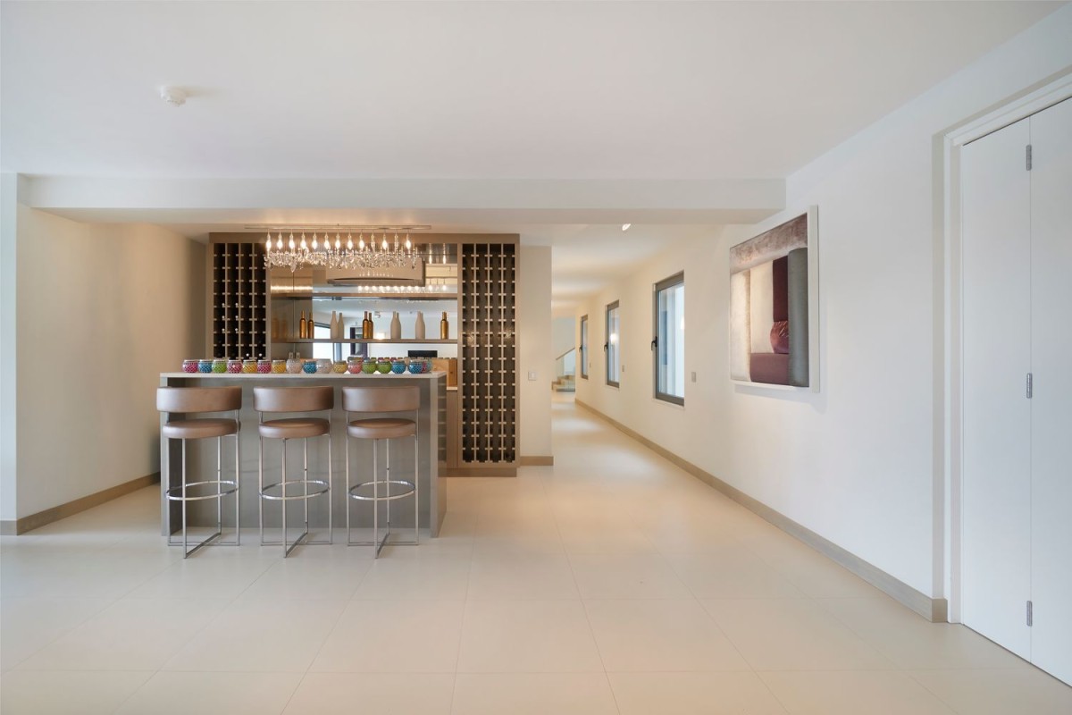 You will also find this spacious game room with a bar downstairs