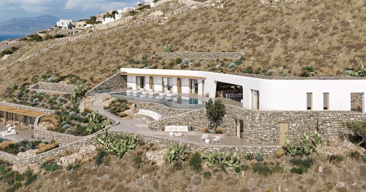 Uma casa de verão espetacular “escondida” numa encosta na ilha grega de Mykonos