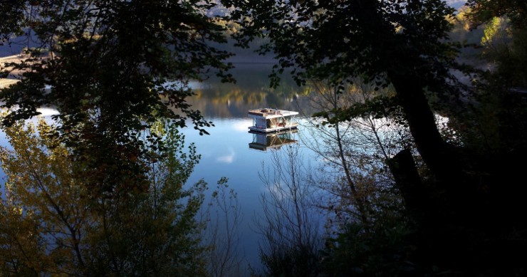 The house boat, floating on the river