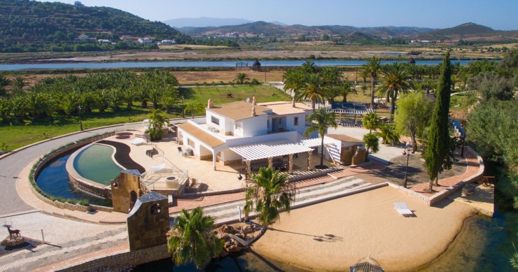 This stunning villa has its own lakeside beach